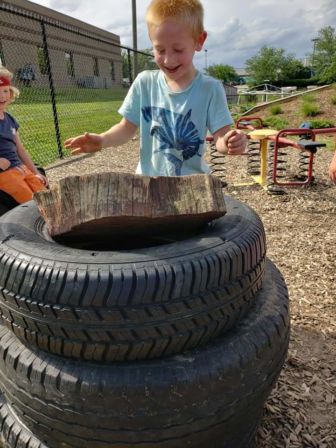 Children stack tires