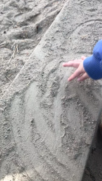 sandbox 1 child drawing in sandbox