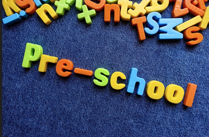 Colorful magnetic letters spell 